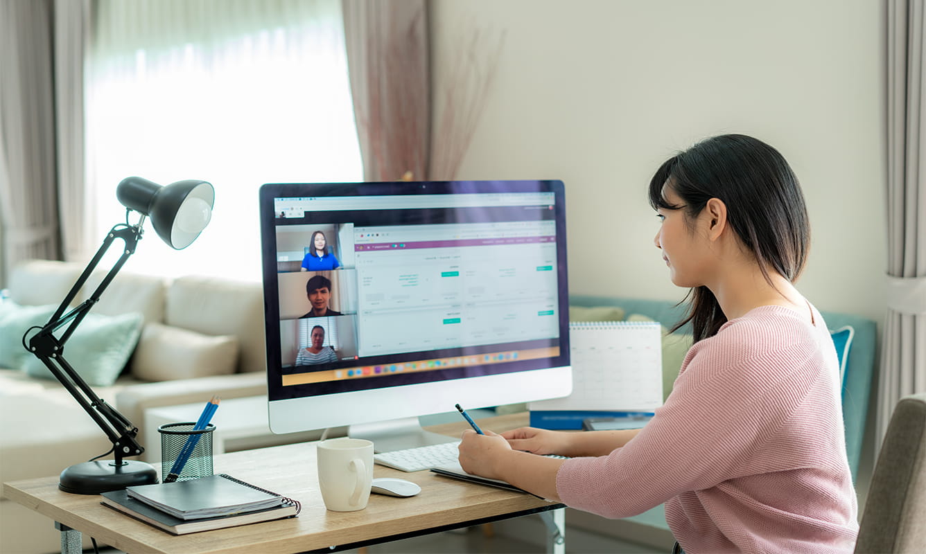 A woman is on a work video conference call