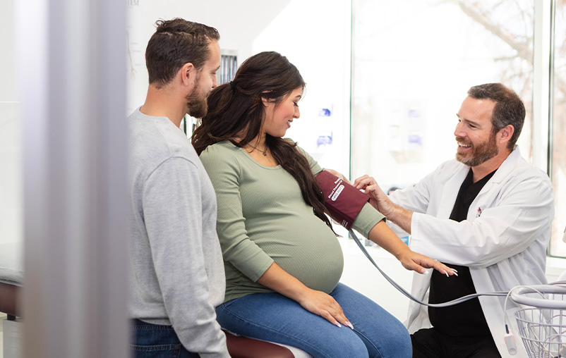 A pregnant woman gets her blood pressure measured.