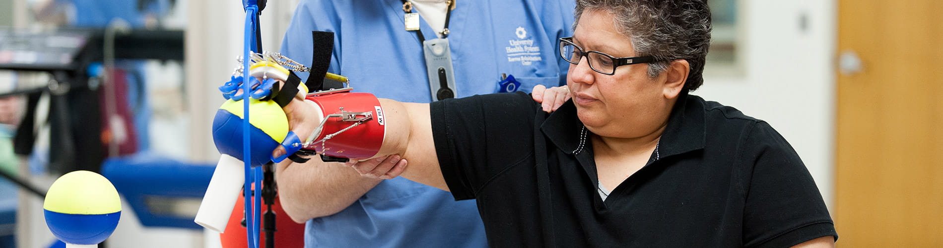 Woman doing physical therapy for her hand.