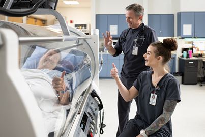 Patient in hyperbaric chamber