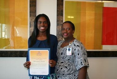 Dr. Brianna Scott receiving her scholarship