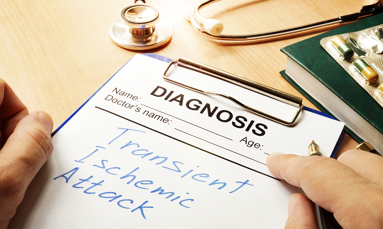 a doctor writes diagnosis of TIA