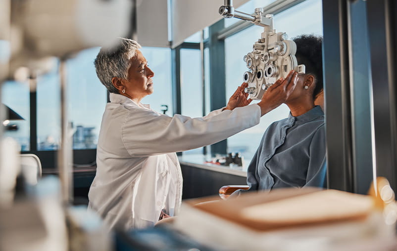 A woman gets an eye exam.