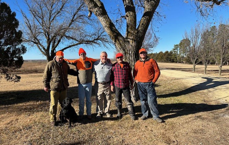 Ronald with his friends outdoors.